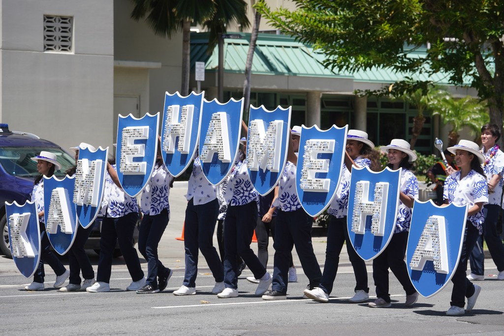 Kamehameha Schools marching band joins in the World Series Little league parade celebration leaving from Aala Park.