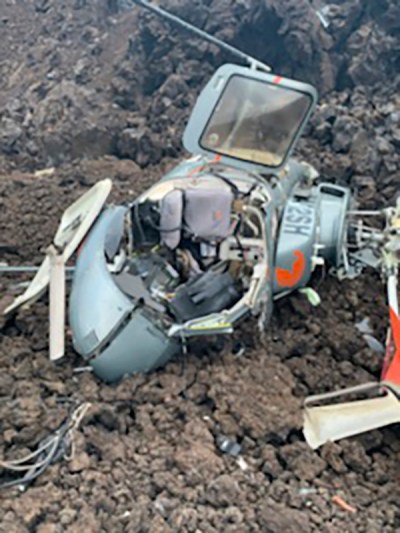 FILE - In this photo provided by the Hawaii County Fire Department is the scene where a helicopter crashed in a Big Island lava field in Hawaii, Wednesday, June 8, 2022. The National Transportation Safety Board is releasing various documents on Monday, Oct. 31, related to the Hawaii helicopter crash that injured all six people on board the sightseeing tour. (Hawaii County Fire Department via AP, File)