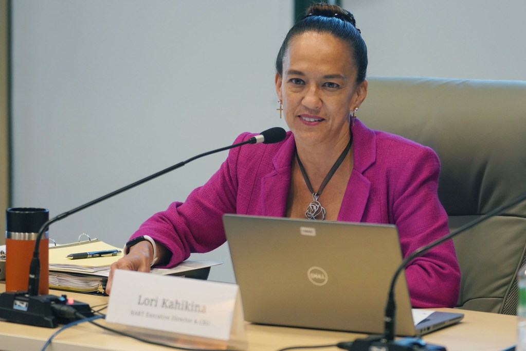 HART CEO Lori Kahikina listens to the HART chair during a board meeting held at Alii Place.