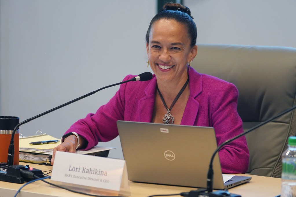 HART CEO Lori Kahikina listens to the HART chair during a board meeting held at Alii Place.