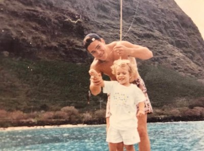 Evan Woodall and his father fishing in 1995