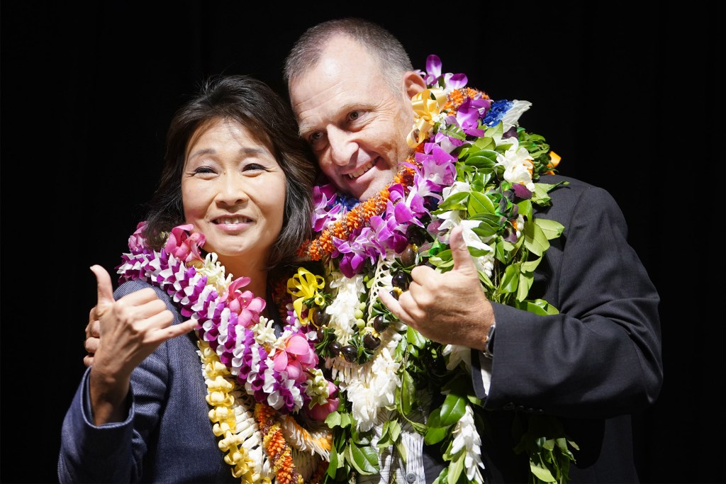 Lt. Governor elect Sylvia Luke and Governor elect Josh Green flash the shaka at the Hawaii Convention Center.