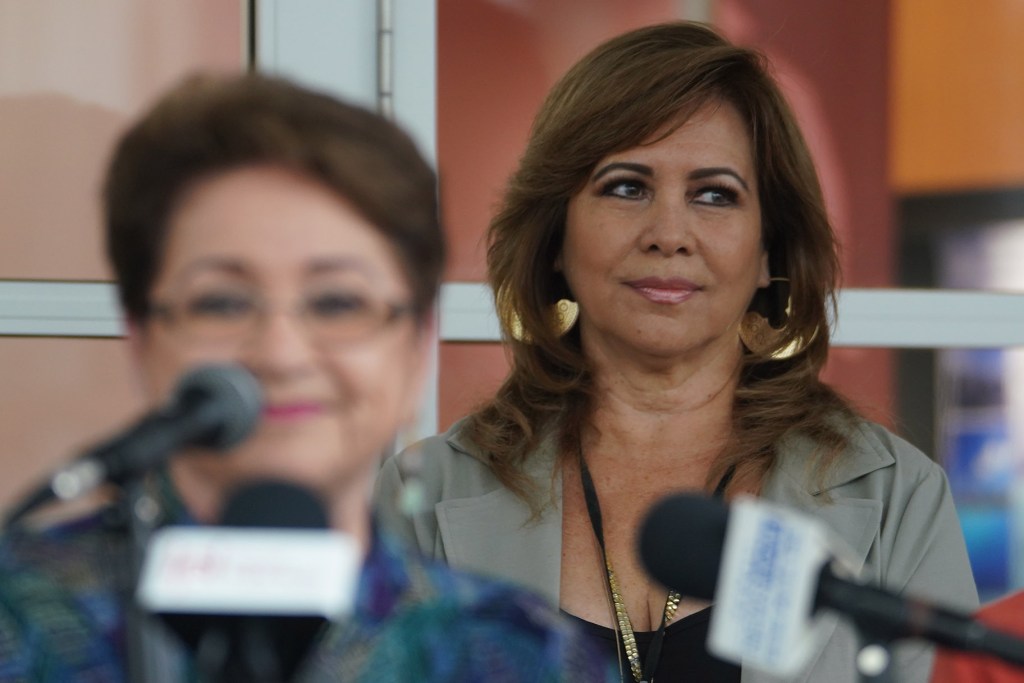 OHA Office of Hawaiian Affairs trustee Luana Alapa listens as Chair Lindsey discusses the results of a forensic audit during a press conference.