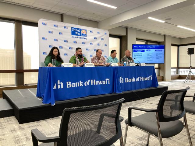 Five people present on a panel