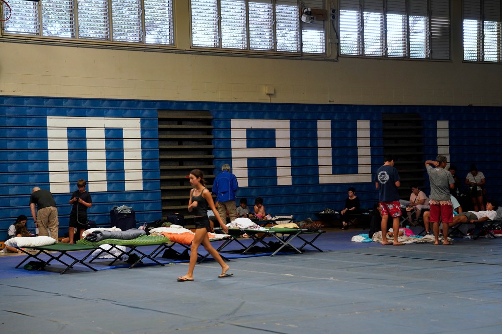 Residents and tourists seek shelter at Maui High School Wednesday, Aug. 9, 2023, in Kahului. A large fire consumed the town of Lahaina. (Kevin Fujii/Civil Beat/2023)
