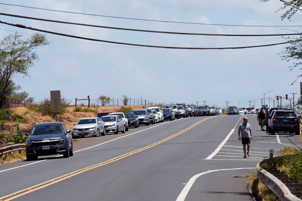 Highway 30, Honoapiilani Highway, toward Lahaina is blocked outside of Maalaea Wednesday, Aug. 9, 2023. A large fire consumed the town of Lahaina. (Kevin Fujii/Civil Beat/2023)