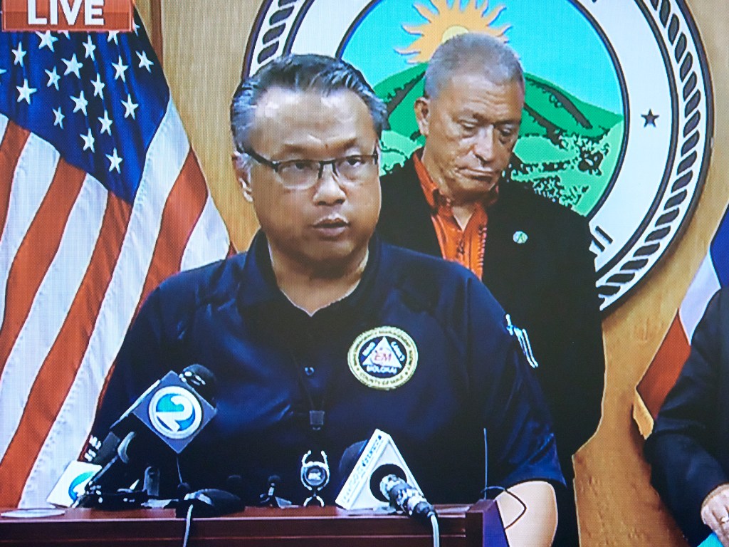Herman Andaya stands at the podium in the Mayors conference room in Wailuku