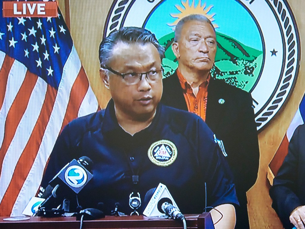Herman Andaya stands at the podium in the Mayors conference room in Wailuku