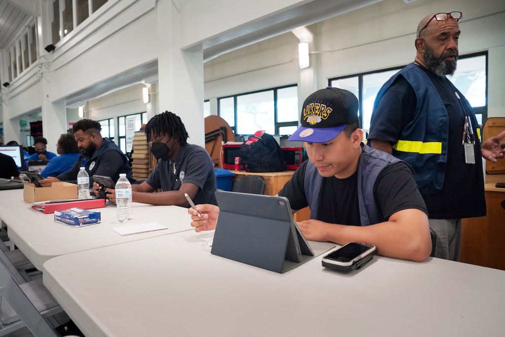 FEMA disaster service assistants wait to help those affected by wildfires on Maui Thursday, Aug. 17, 2023, at the University of Hawaii Maui College in Kahului. A wildfire destroyed the historic town of Lahaina last week. (Kevin Fujii/Civil Beat/2023)