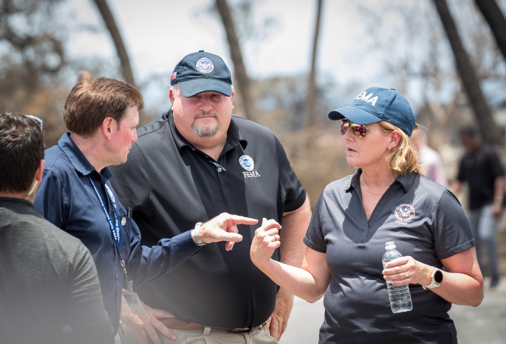 Robert Fenton, center, is chief federal response coordinator for Maui to lead long-term recovery work. FEMA Administrator Deanne Criswell, left, also joined Biden during his visit to Lahaina. (Nathan Eagle/Civil Beat/2023)