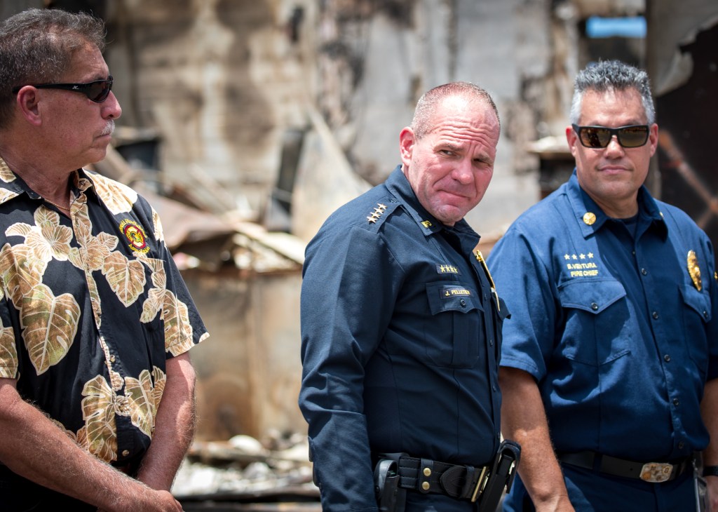 Maui Police Chief John Pelletier waits for President Biden to visit Front Street, Lahaina, Monday. (Nathan Eagle/Civil Beat/2023)
