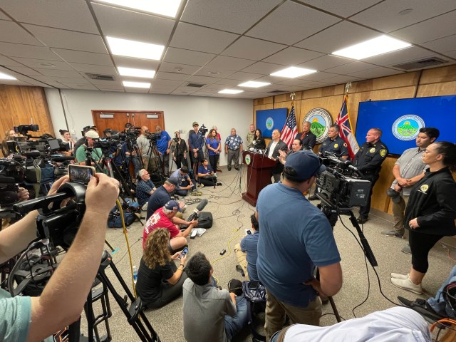 Reporters and camera crews packed into a conference room at a state building in Waikluku to hear updates about the fires in Lahaina and elsewhere on Maui.