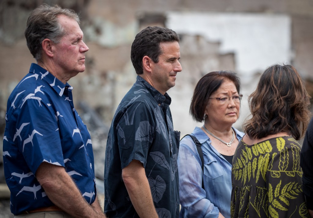 U.S. Sen. Brian Schatz, center, and the rest of Hawaii's congressional delegation, including U.S. Rep. Ed Case, left, Sen. Mazie Hirono, right, and Congresswoman Jill Tokuda (not pictured) renewed their commitment to helping Maui recover. (Nathan Eagle/Civil Beat/2023)