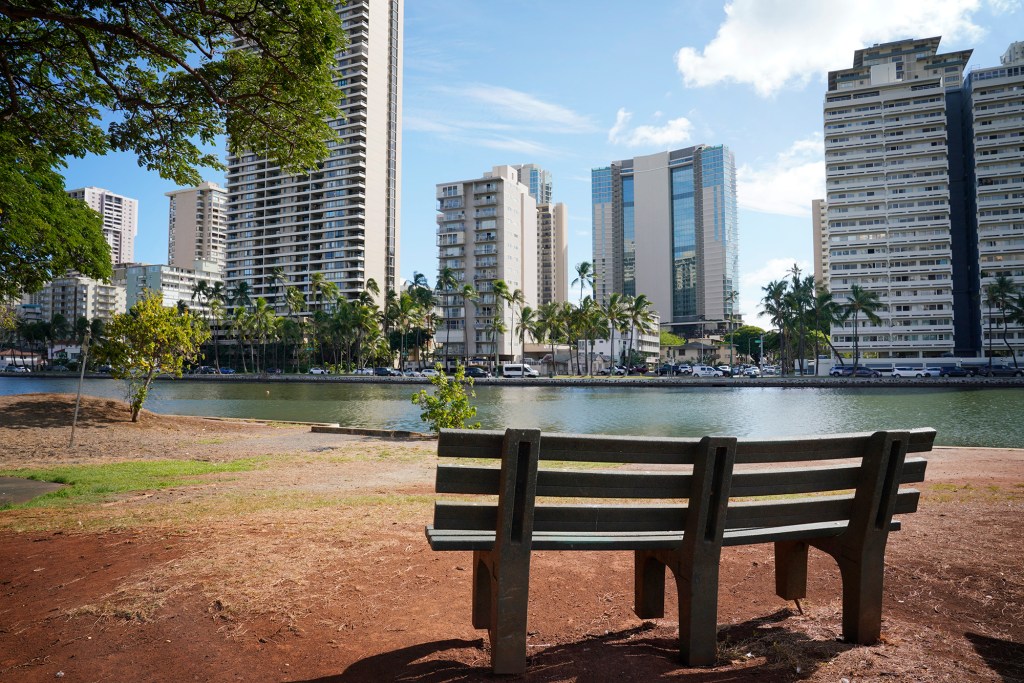 The site of a proposed pedestrian bridge over the Ala Wai Canal is photographed Thursday, Sept. 21, 2023, in Honolulu. Moiliili residents are concerned the bridge would allow vagrants and beach goers easier passage into their neighborhood. (Kevin Fujii/Civil Beat/2023)