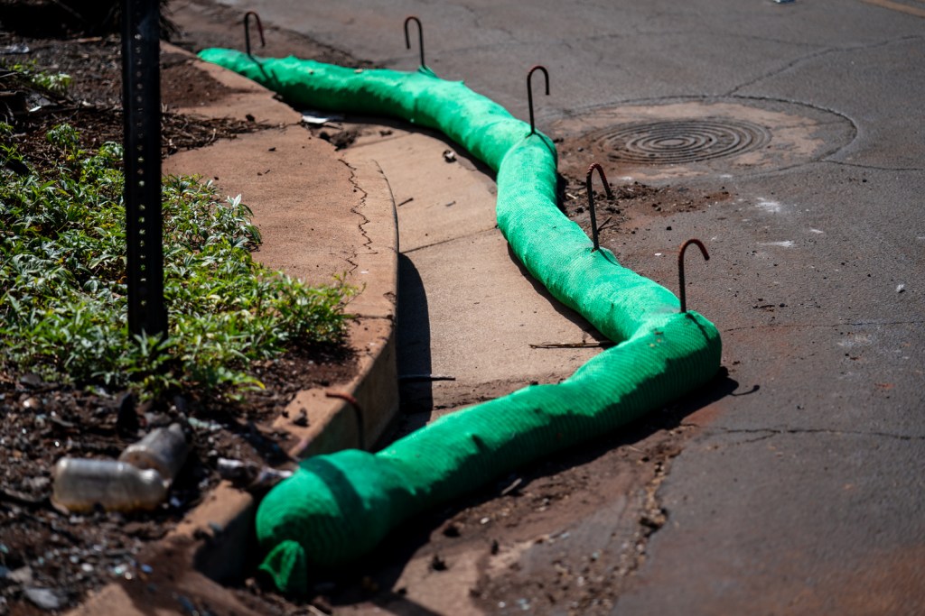 Tubes have been placed around drains in Lahaina neighborhoods to help prevent potentially toxic runoff from reaching nearshore waters. (Nathan Eagle/Civil Beat/2023)