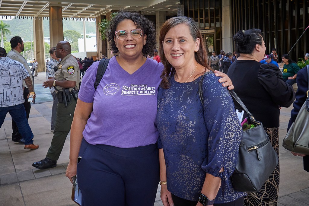 Two executives standing together in the Rotunda of the Hawaii State Capital Building