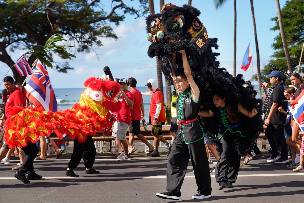 The Hoʻūlu Lahaina Unity Walk included representation of Lahaina residents which included traditional Chinese dragon dancing Saturday, Jan. 20, 2024, in Lahaina. Uncle Archie Kalepa organized the Lele Aloha group to bring the diverse people of Lahaina together after the devastating Aug. 8 fire destroyed the historic West Maui town. (Kevin Fujii/Civil Beat/2024)