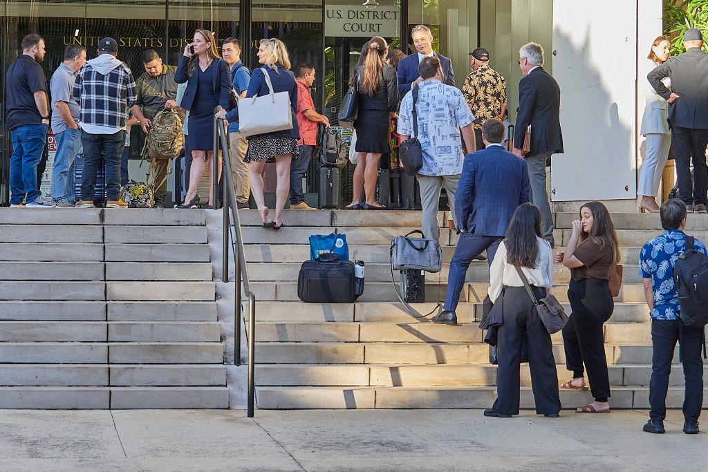 a crowd outside the Federal Courthouse building