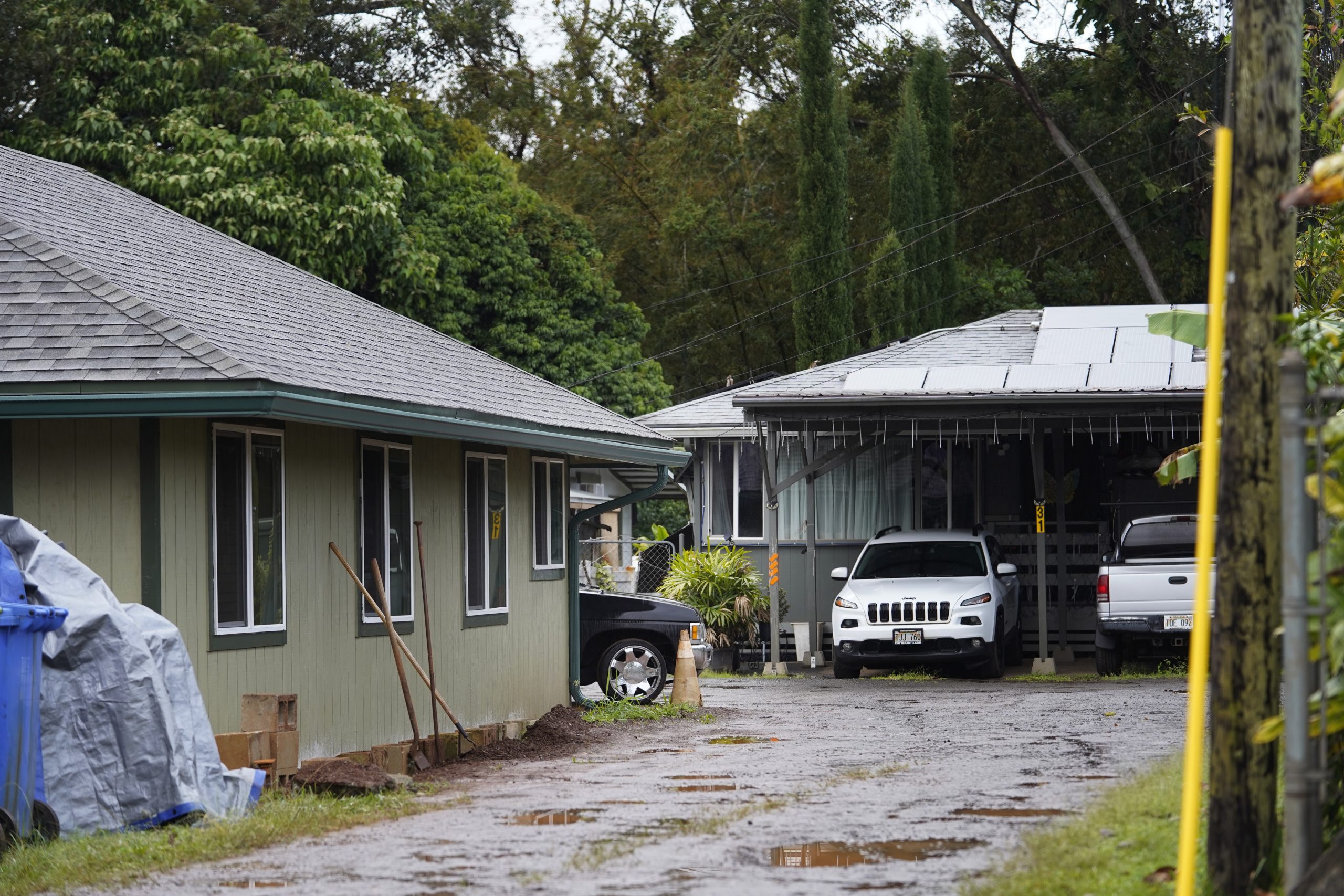 Ten-year-old Geanna Bradley was found dead in the house obscured by the green house in the foreground photographed Friday, Feb. 9, 2024, in Wahawa. First responders found the girl dead on scene Jan. 18. The Honolulu medical examiner determined Bradley died from neglect, pneumonia and starvation. Three people are in custody for Bradley’s death: non-biological parents Brandy and Thomas Glass and non-biological grandmother Debra Geron. (Kevin Fujii/Civil Beat/2024)