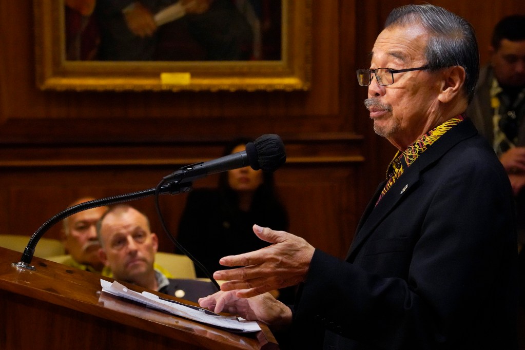 Gov. Josh Green listens to One Ohana Fund administrator retired Judge Ronald Ibarra Tuesday, Feb. 27, 2024, in Honolulu. The fund is designed to compensate loss of life and injury for those who survived the Aug. 8 fire on Maui. (Kevin Fujii/Civil Beat/2024)