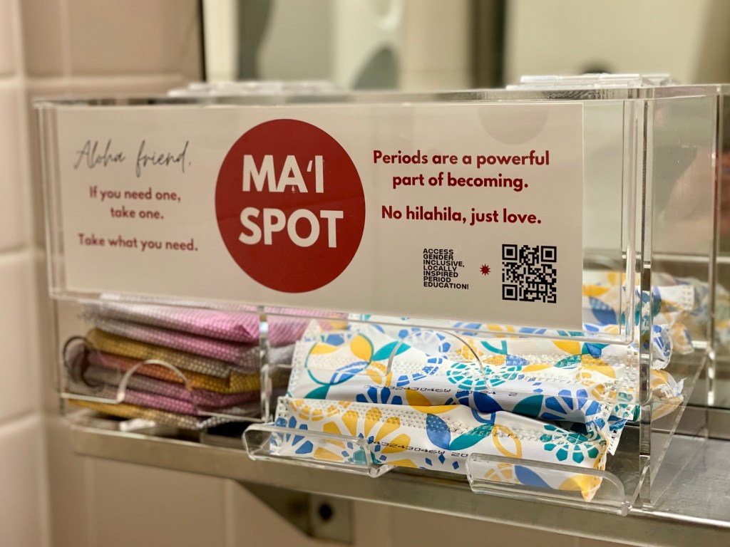 A plastic dispenser provides free period products in a bathroom on the third floor of the State Capitol. Bills being considered this year would expand such access to UH campuses and public buildings. (Gabriela Cervantes/Civil Beat/2024)