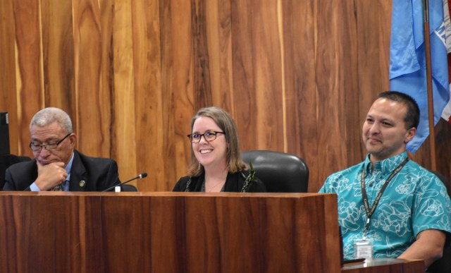 Kate Blystone is flanked by her supporters, Maui County Mayor Richard Bisssen (left) and Josiah Nishita, head of the new Office of Recovery, during her confirmation before the County Council. (Cammy Clark/Civil Beat/2024)