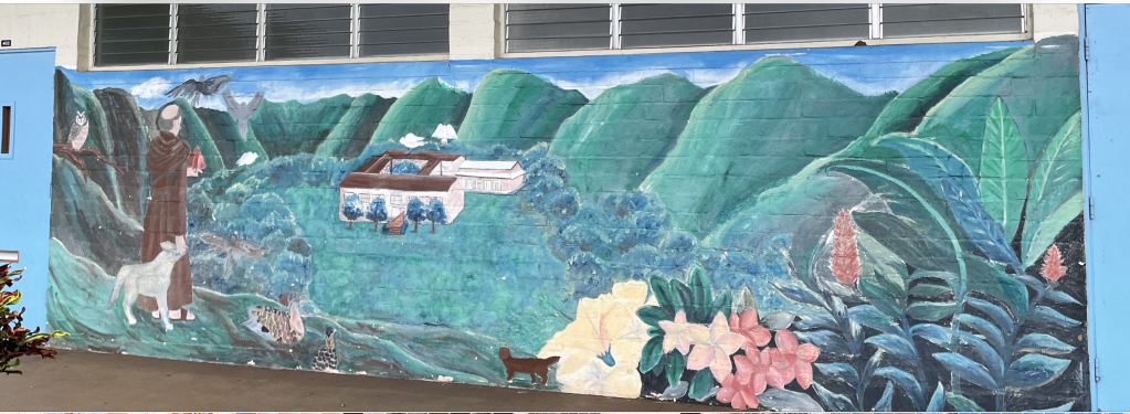 Mural depicting St. Francis and his flock and mountains of Manoa.
