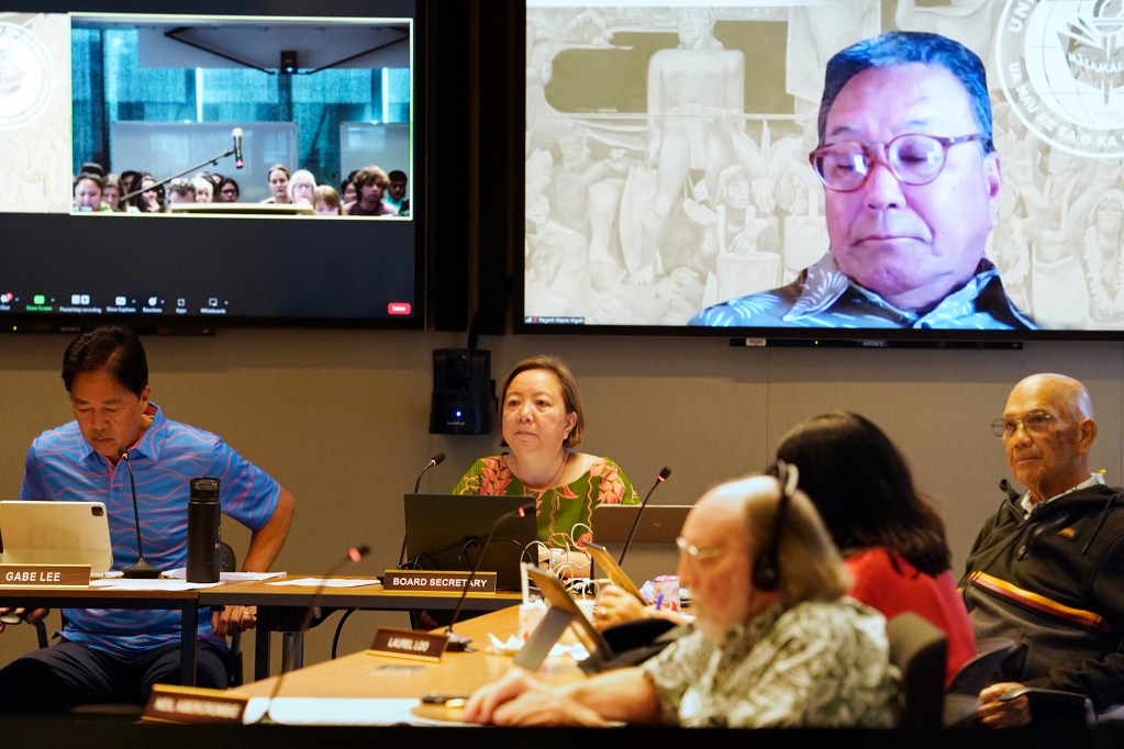The giant, floating head belongs to University of Hawaii Regent Wayne Higaki as he listens remotely to a speaker during the Board of Regents meeting Thursday, March 21, 2024, in Honolulu. On the agenda was electing officers after former Chair Alapaki Nahale-a was not re-confirmed by the state Senate. (Kevin Fujii/Civil Beat/2024)