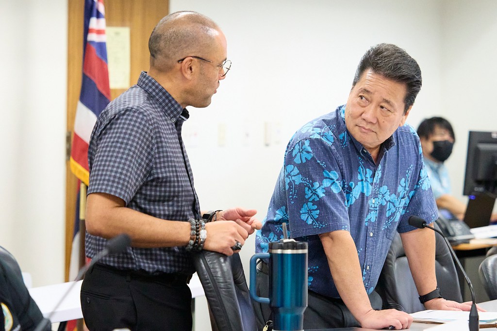 Donovan Dela Cruz Senate Ways and Means Chair spars with House Finance Chair Kyle Yamashita, before a committee hear for the financing of Bills 
(David Croxford/Civil Beat/2024)