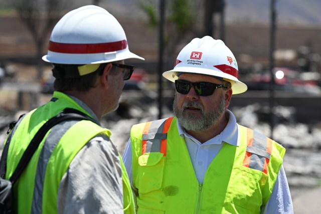 Mark Wingate, Federal Emergency Management Agency debris task force leader, left, and U.S. Army Corps of Engineers debris subject matter expert Cory Koger, coordinate with partners in Lahaina, Hawai’i, Sept. 5. The Corps of Engineers team is working with Maui County, state of Hawai’i, Federal Emergency Management Agency partners and others to support survivors in the recovery process following the wildfires Aug. 8. They were onsite to gather information to help the team develop plans as they move forward. The Corps of Engineers will not begin removing debris until they have a signed right-of-entry form completed by the property owner. 
Cultural awareness of the impacted communities is a top priority for the Corps of Engineers, and they will employ cultural monitors during the entire process to ensure they respect the community, culture and recovery efforts.