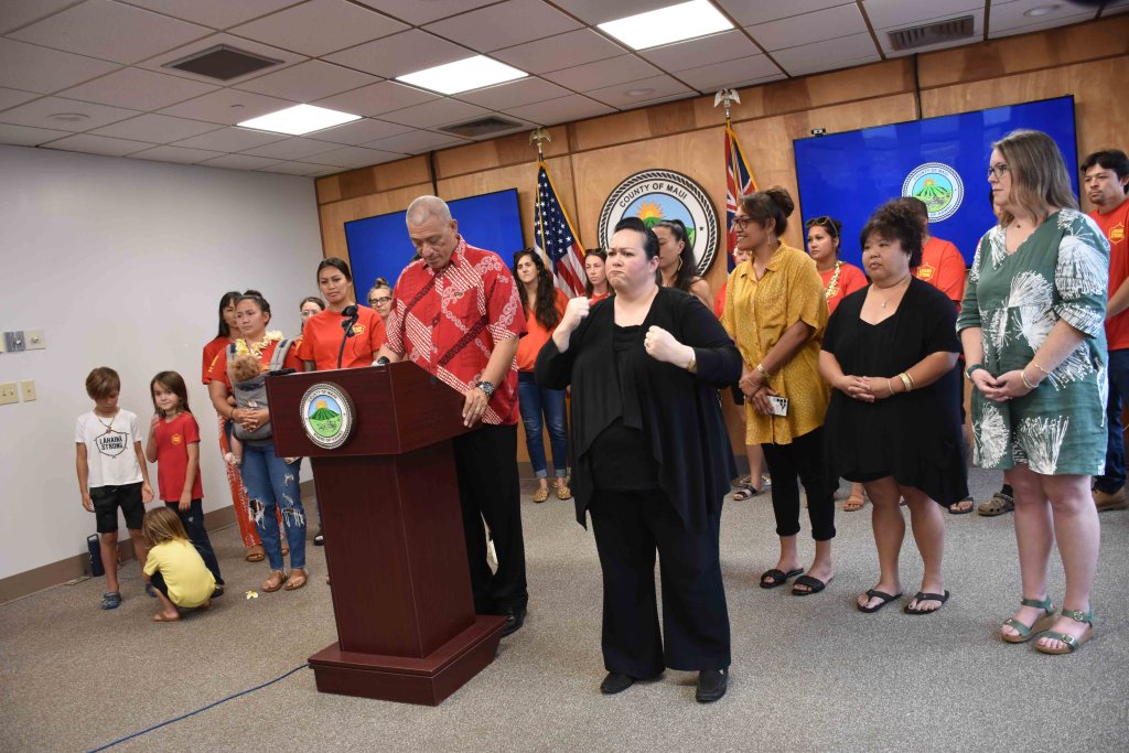 Maui Mayor Richard Bissen, flanked by members of Lahaina Strong and county staff, announces a bill that would eliminate more than 7,000 short-term rentals on Maui by 2026. (Cammy Clark/Civil Beat/2024)