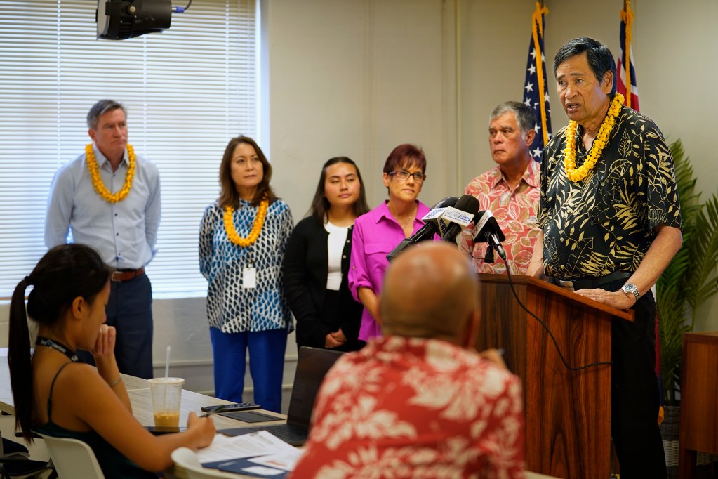 Kali Watson, at right, Director, Department of Hawaiian Home Lands speaks about introducing a resolution to create housing for Native Hawaiians in Kailua on Tuesday, June 4, 2024, in Honolulu. (Kevin Fujii/Civil Beat/2024)