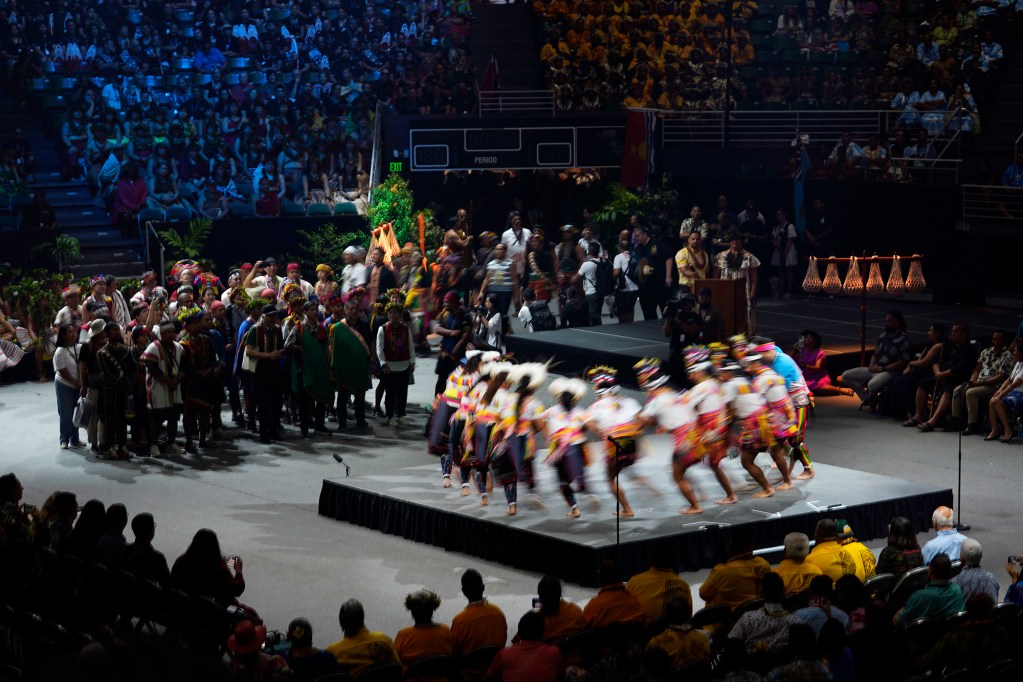 Taiwan performs before the 13th Festival of Pacific Arts & Culture opening ceremony parade of nations Thursday, June 6, 2024, in Honolulu. Known as FestPac for short, takes place every four years, however, missing the last event because of COVID. A slow shutter speed captures the dancers in a blur. (Kevin Fujii/Civil Beat/2024)