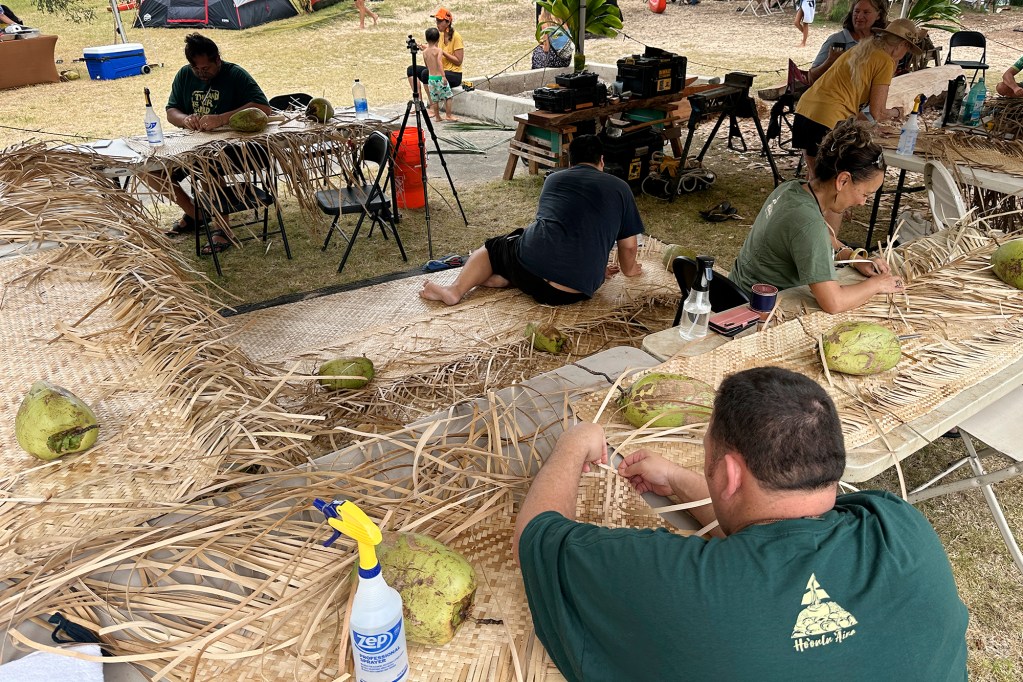 The Aotearoa delegation weaves a sail Sunday, June 9, 2024, at Kualoa Regional Park in Kaneohe. The Aotearoa delegation is part of FestPac. (Kevin Fujii/Civil Beat/2024)
