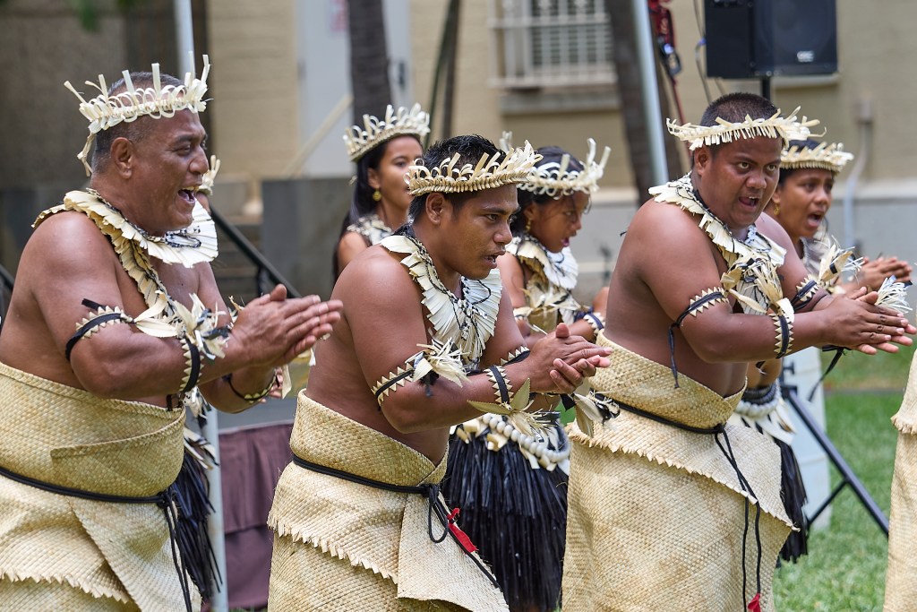 FestPac continued on June 11th at Capital Modern with exhibitions, displays and dance performances. A group from Kiribati performed traditional dances on the front lawn of the facility wearing their traditional outfits. (David Croxford/Civil Beat/2024)