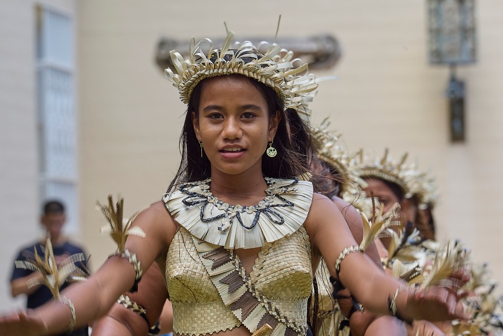 FestPac continued on June 11th at Capital Modern with exhibitions, displays and dance performances. A group from Kiribati performed traditional dances on the front lawn of the facility wearing their traditional outfits. (David Croxford/Civil Beat/2024)