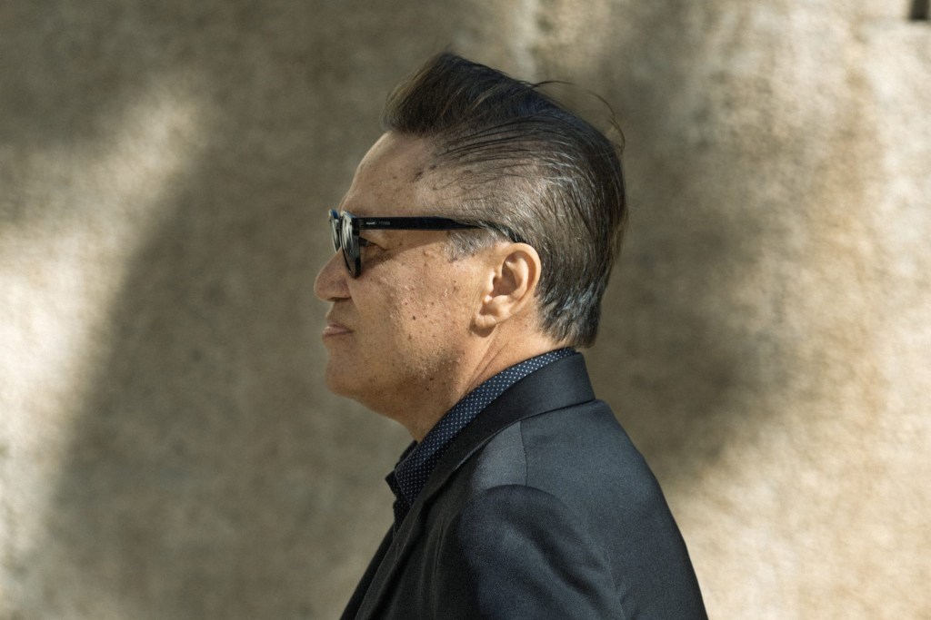 Milton Choy walking into the U.S. District Courthouse.