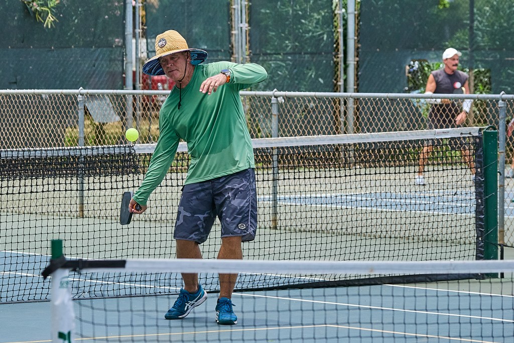 For the last decade PickleBall has been gaining in popularity all over the United States. While not as refined as the game of Tennis, the sport does provide its own sense of accomplishment and thrills.  This set of images were recorded at the Diamond Head Tennis Center on Paki Avenue close to Waikiki.
Photographed July 15th, 2024 (David Croxford/Civil Beat/2024)