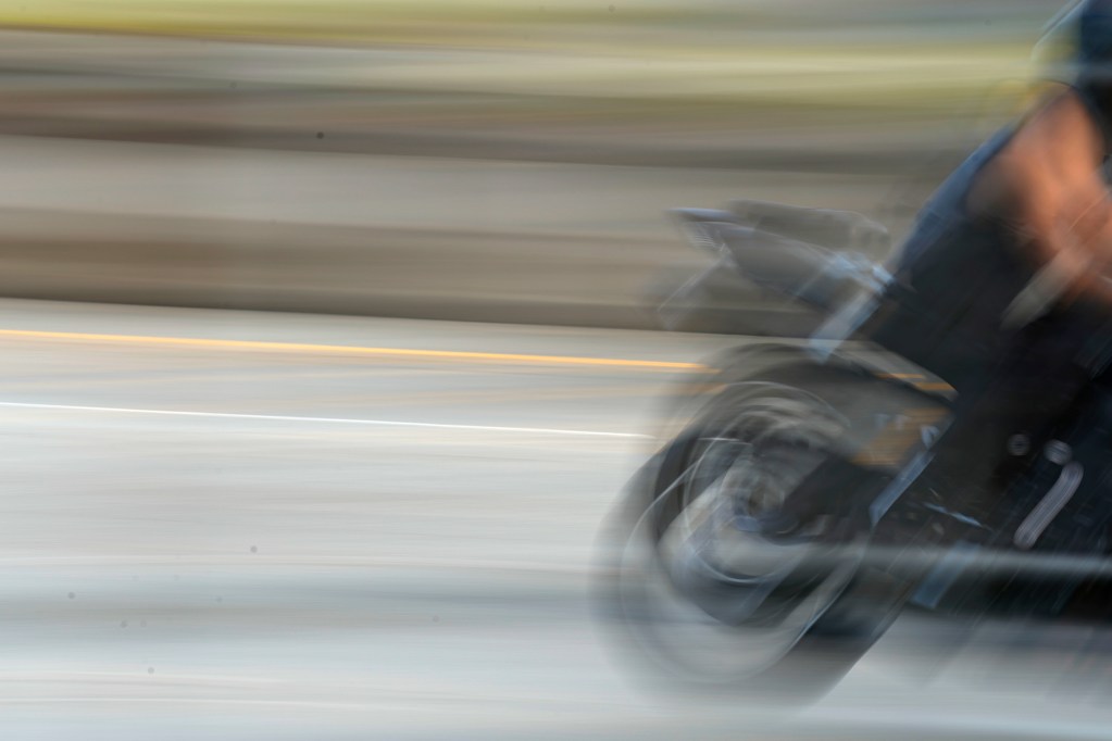A motorcycle whizzes by Tuesday, July 16, 2024, in Waipahu. (Kevin Fujii/Civil Beat/2024)