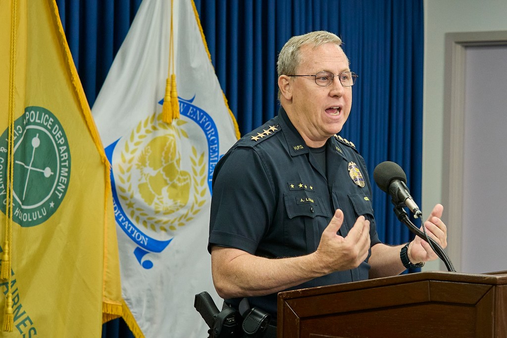 HPD Chief Joe Logan reports information of the fatal Police shooting at 2509 Ala Wai Blvd. The barricaded victim came out of the apartment brandishing a gun and pointed toward officers after non lethal canisters containing CS gas were deployed. The officers returned fire and fatally wounded the suspect who was believed to be the culprit in three earlier robberies.(David Croxford/CivilBeat/2024)