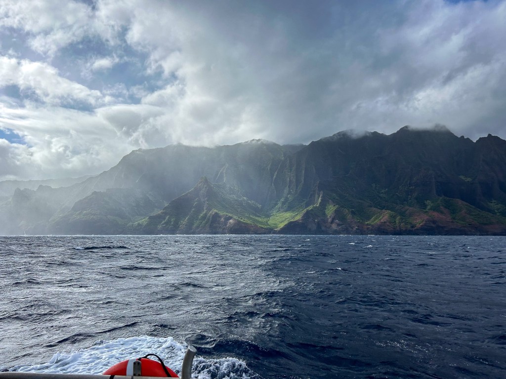 A Coast Guard Station Kauai 45-foot response boat-medium crew conducts search patterns during a joint search and rescue operation in the waters off the Na Pali Coast of Kauai, July 13, 2024. The Coast Guard and partner agency crews conducted a joint search and rescue operation for two missing individuals after a helicopter crashed into the waters off the Na Pali Coast in Kauai, Hawaii. (U.S. Coast Guard photo by PA2 Tyler Robertson)