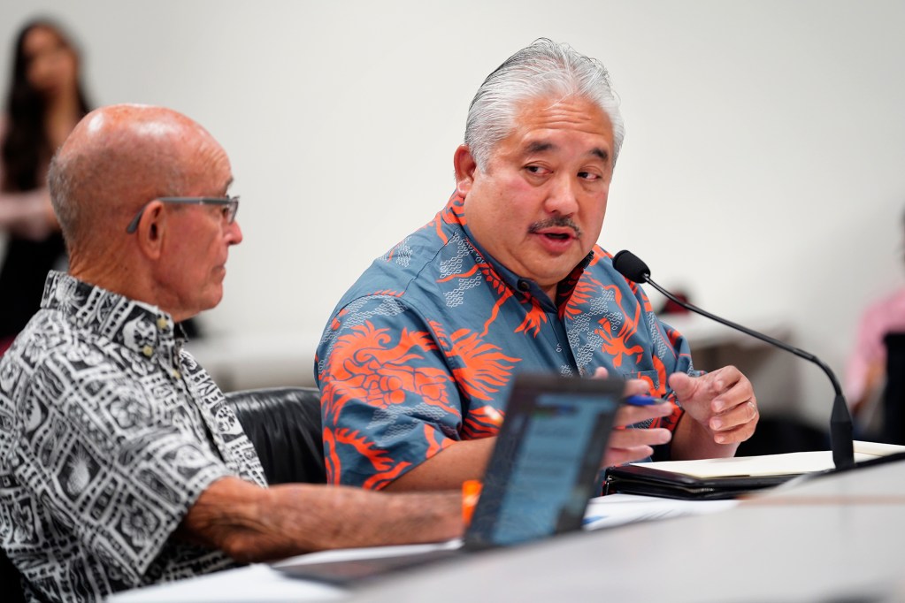 Department of Education Deputy Superintendent Randy Moore, left, and Superintendent Keith Hayashi address the Hawaii state House of Representatives Committee on Education during a special Informational Briefing on Thursday, Aug. 15, 2024, in Honolulu. The hearing outside of regular session is to learn about the bus-driver shortage and informing parents with only three days before school began. (Kevin Fujii/Civil Beat/2024)