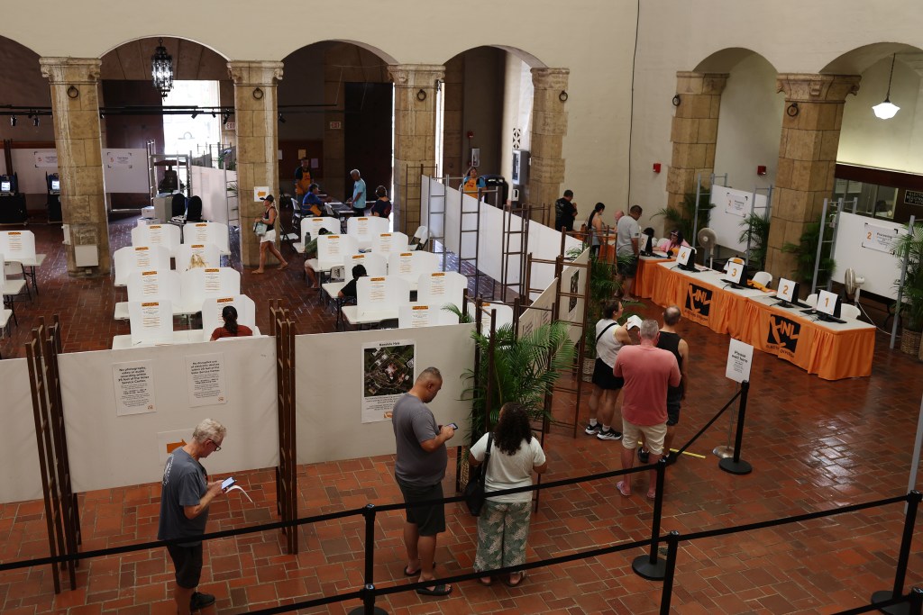 Voters line up at Honolulu Hale to vote, Saturday, August 10, 2024 in Honolulu. Marco Garcia/CivilBeat/2024