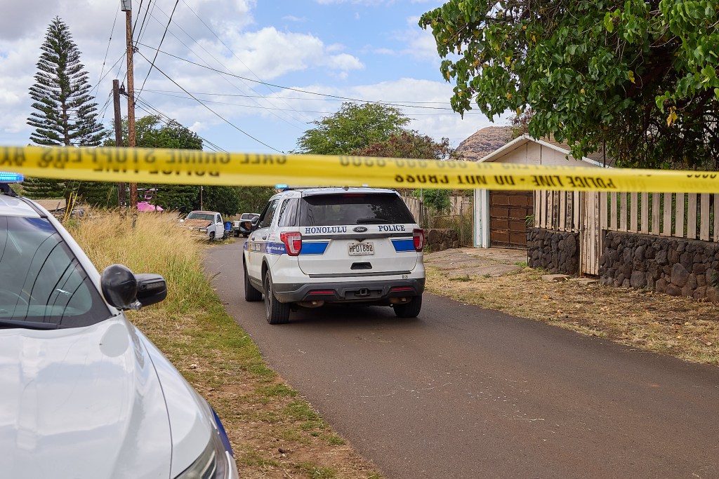 Honolulu Police Dept maintained a presence in the 85-1300 block of Waianae Valley Road on Sunday afternoon while investigations proceeded into the fatal shooting of three individuals at a graduation party around 11.30pm on Saturday evening August 31st, 2024. (David Croxford/Civil Beat/2024