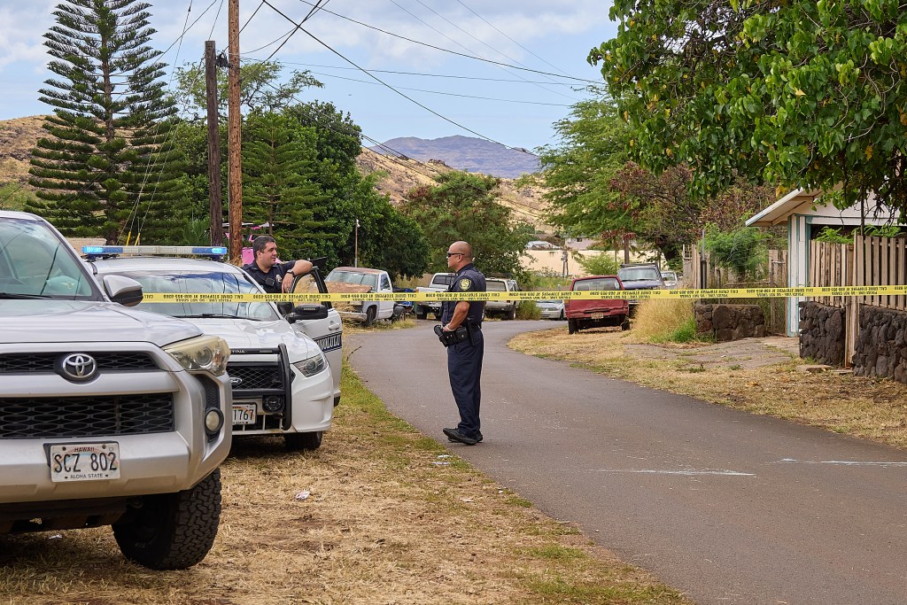Honolulu Police Dept maintained a presence in the 85-1300 block of Waianae Valley Road on Sunday afternoon while investigations proceeded into the fatal shooting of three individuals at a graduation party around 11.30pm on Saturday evening August 31st, 2024. (David Croxford/Civil Beat/2024