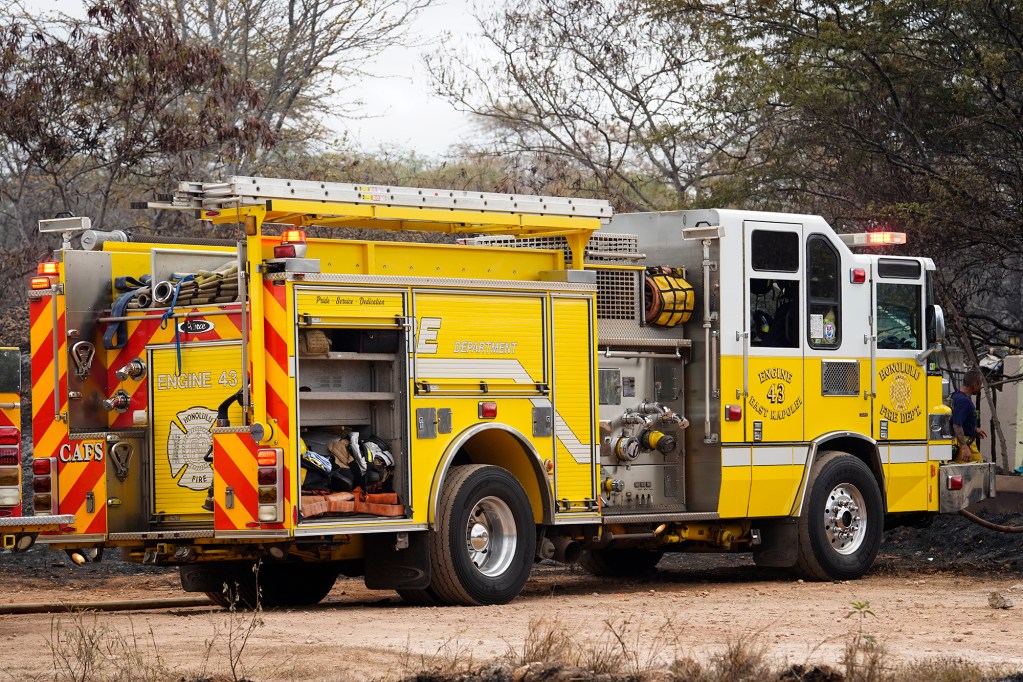 Honolulu Fire Department firefighters with Engine 43 East Kapolei continues to monitor hot spots from the previous day’s vegetation fire Monday, Sept. 16, 2024, in the Kalaeloa area of Ewa Beach. (Kevin Fujii/Civil Beat/2024)