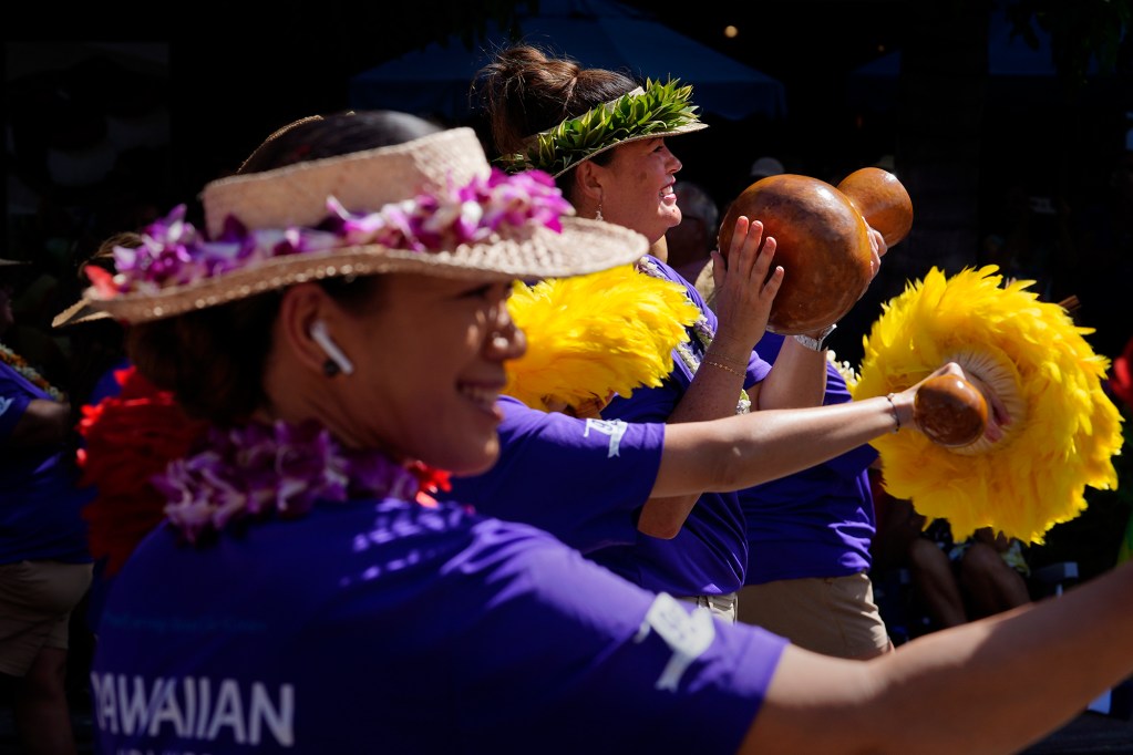 Hawaiian Airlines marches down Kalakaua Avenue with traditional hula ipu and uliuli during the Aloha Festivals 76th Annual Floral Parade Saturday, Sept. 25, 2024, in Honolulu. (Kevin Fujii/Civil Beat/2024)