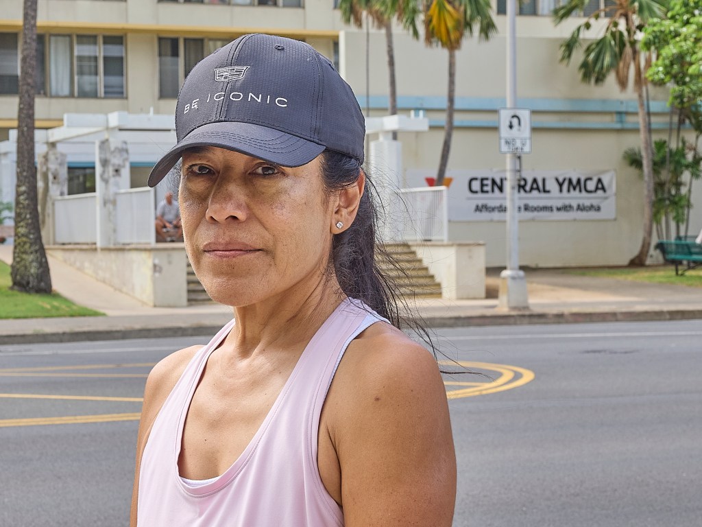 Suzanne Spencer has been a resident at the Central YMC on Atkinson Drive for a while and has received notice that her rent there will rise on November 1st.  She is photographed across from her residence on October 29th.(David Croxford/Civil Beat/2024)