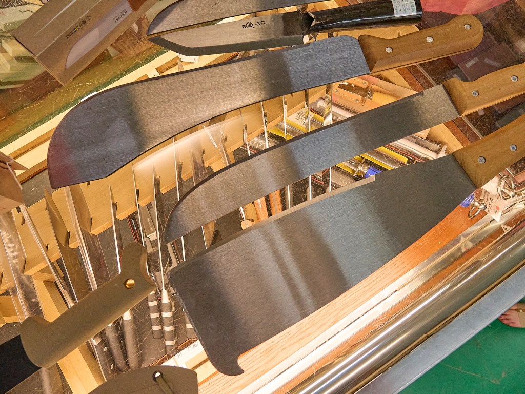 A series of photographs of Machetes of various shapes and sizes from 14 inch blades to the smaller bladed Sugar cane Machete. (David Croxford/Civil Beat/2024)