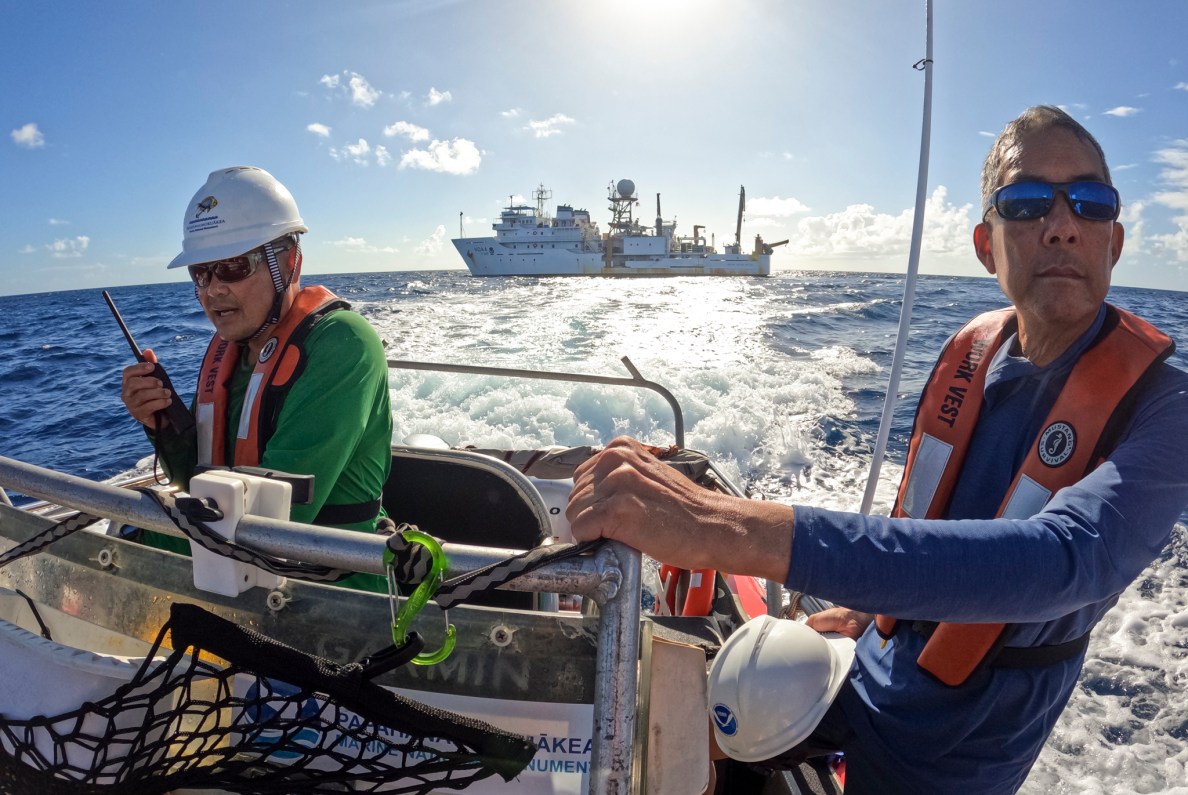 Jason Leonard, left, and Randy Kosaki head out to East Island on a SAFE boat that launched from the Oscar Elton Sette, NOAA's research vessel. (Nathan Eagle/Civil Beat/2024)